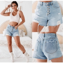 Washed denim shorts with holes and rough edges Y663621750412